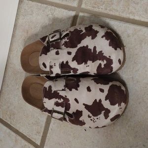 Cow print clogs